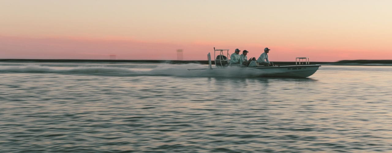 Group on a boat at dusk.