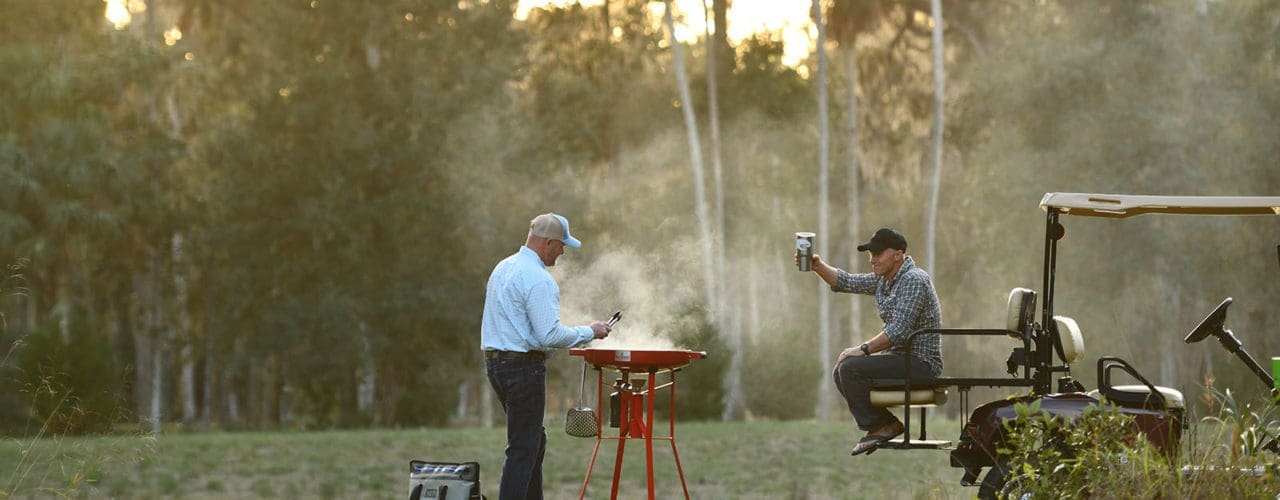 Couple grilling on their Firedisc.