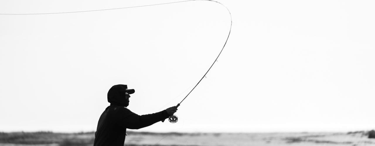 Man throwing fishing line.