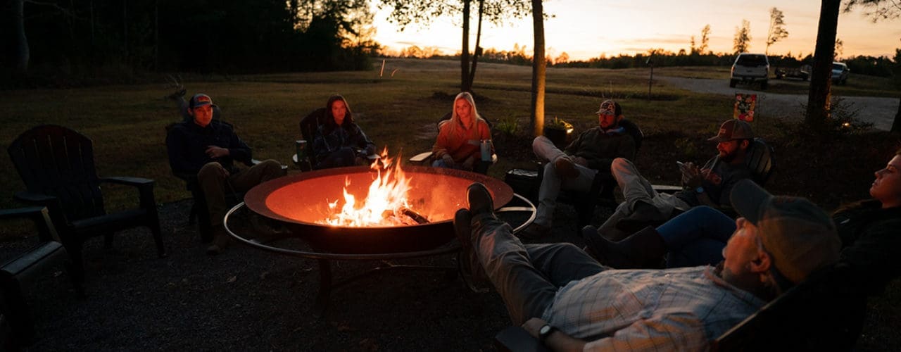 Group of people around a bonfire.