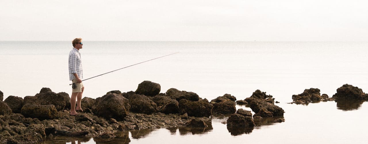 Man fishing in the ocean.