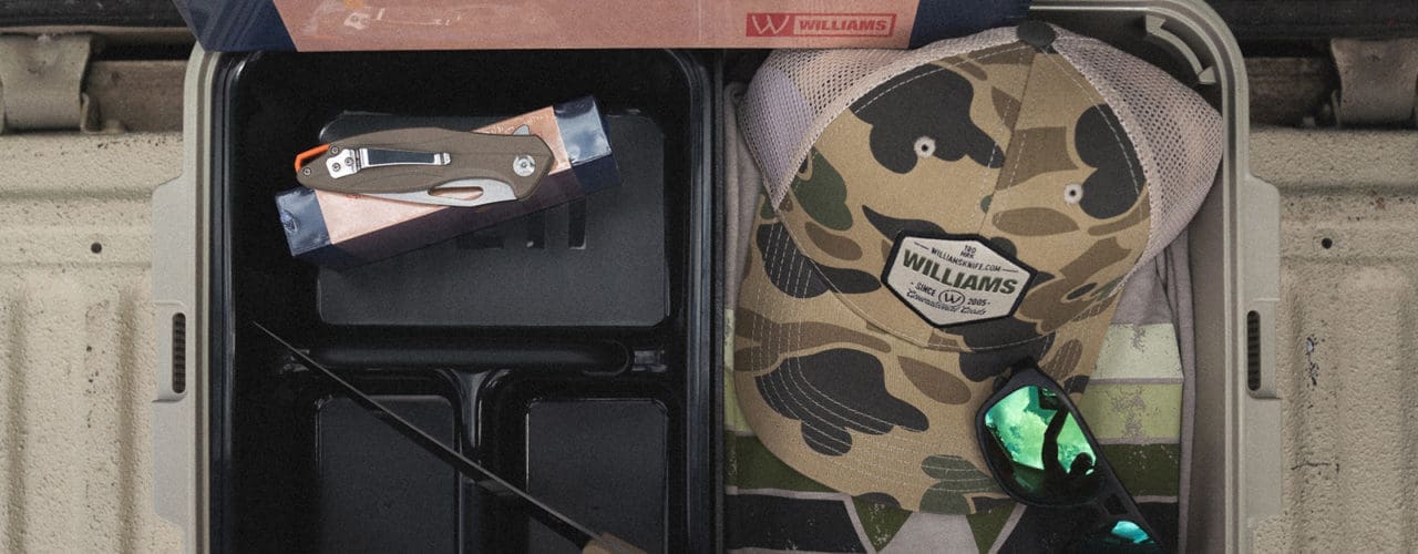 box with hat, sunglasses, knife