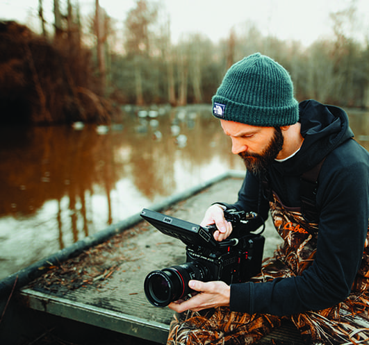 Videographer reviewing footage