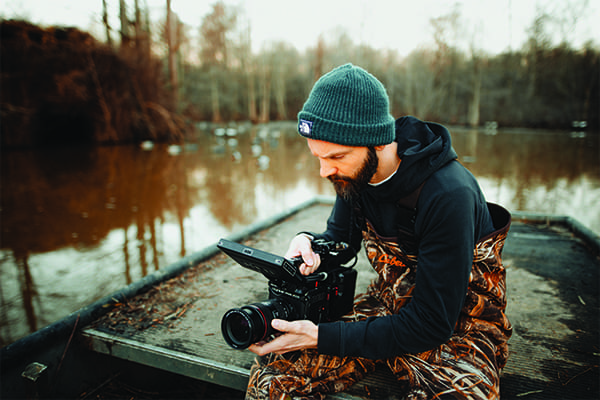 Videographer reviewing footage