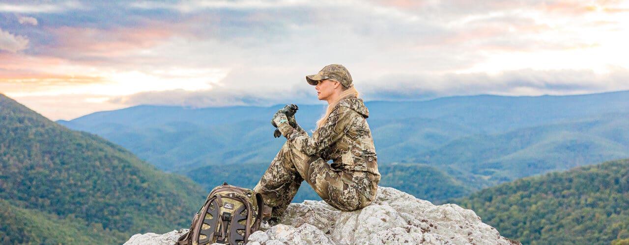 girl sitting on mountain